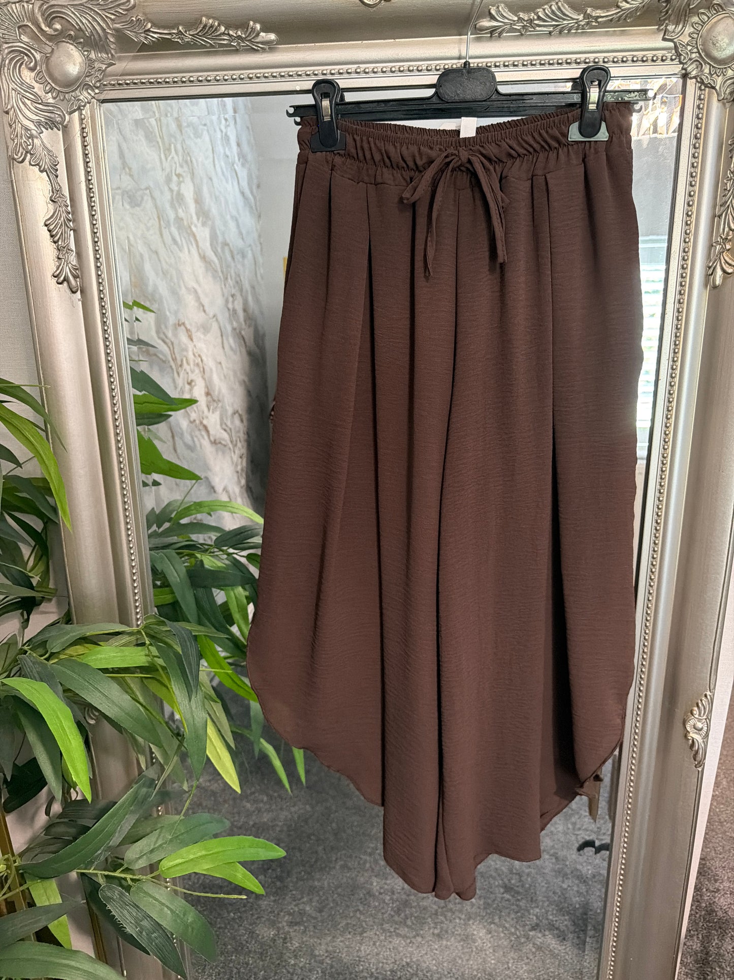 Brown pleat front trousers