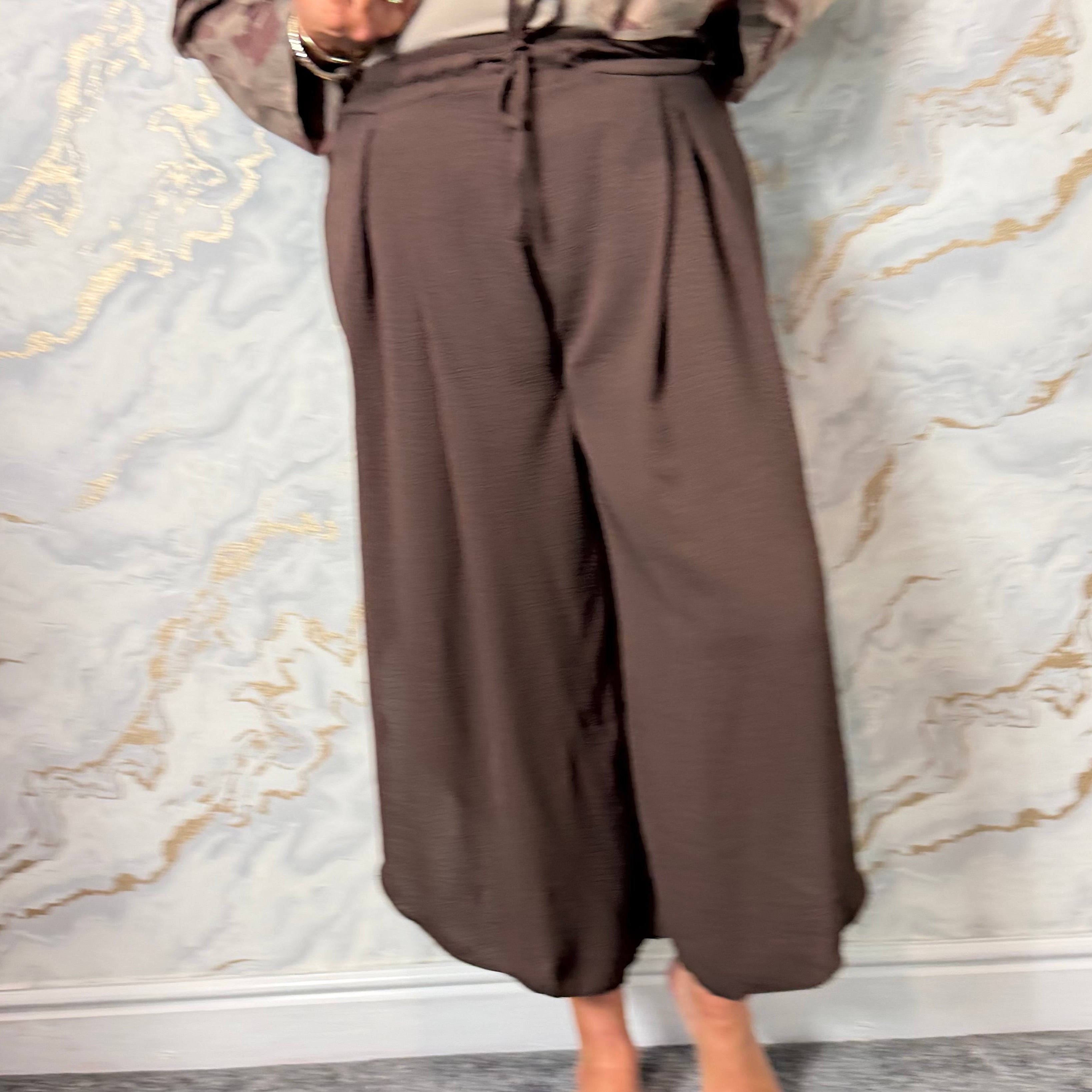 Brown pleat front trousers