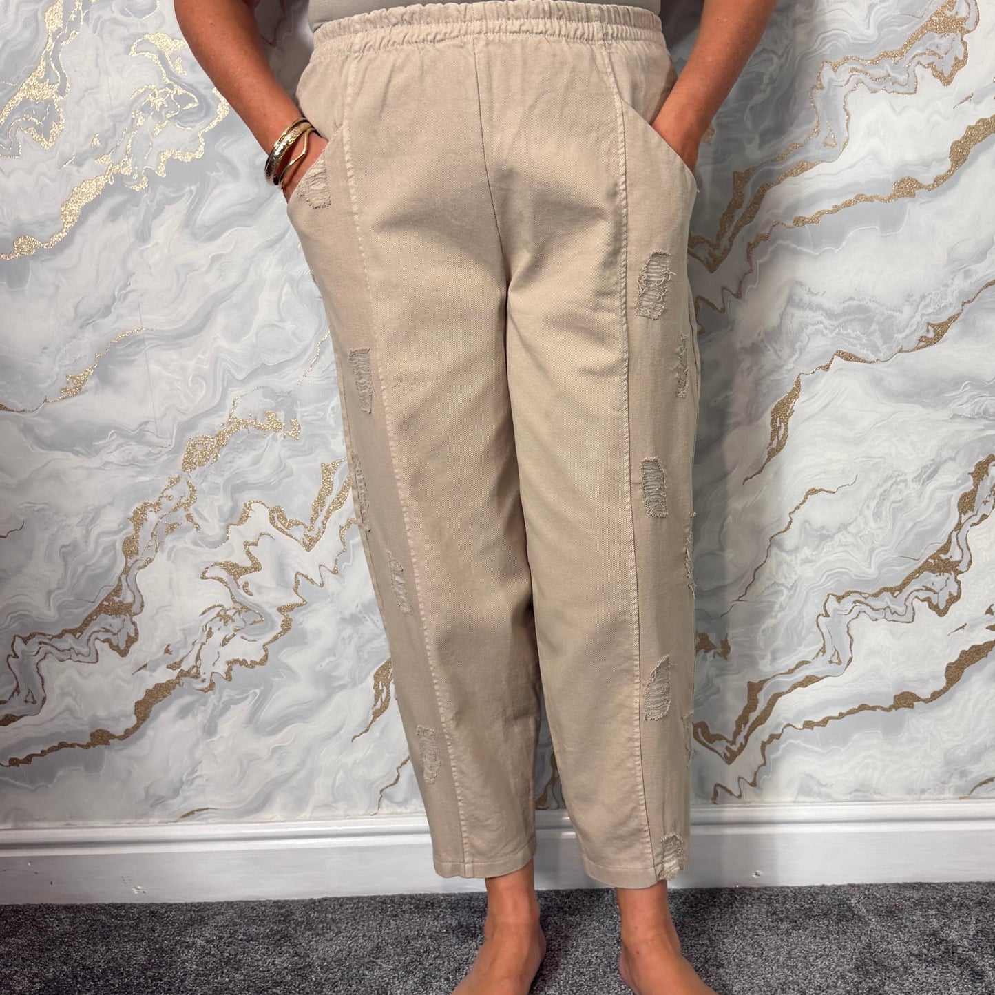 Distressed barrel leg trousers